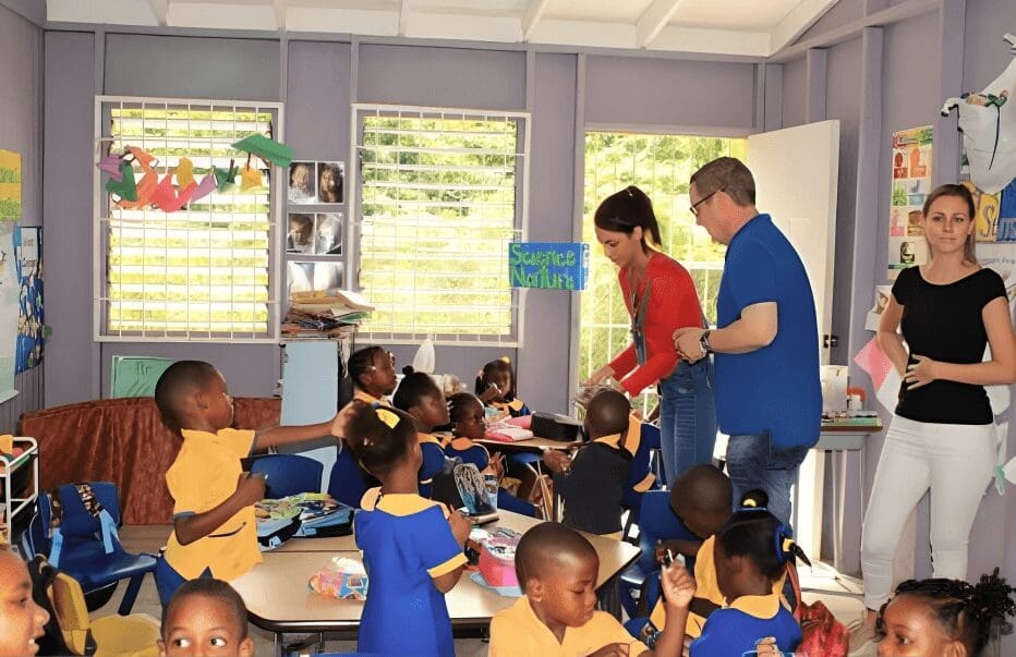 Classroom of children learning with teachers.